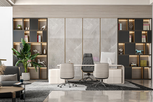Royal Apex Interior Works Portfolio - Modern Office Interior A modern office interior with a stylish desk, chair, and computer. The walls are painted a light gray color, and the floor is made of wood. The windows are large and let in plenty of natural light. The overall space is comfortable and inviting.